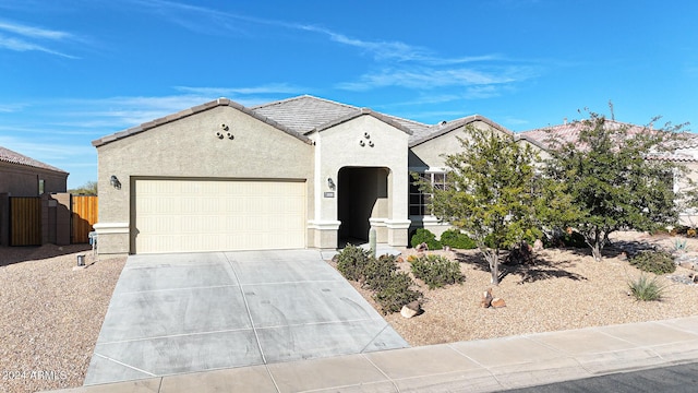 ranch-style home featuring a garage