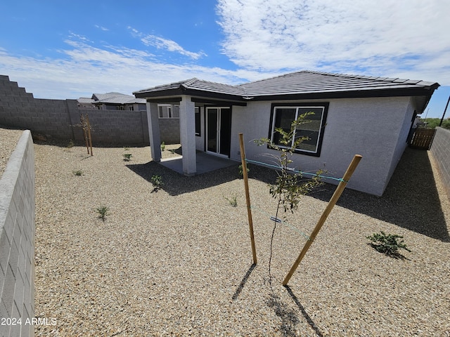 rear view of house with a patio