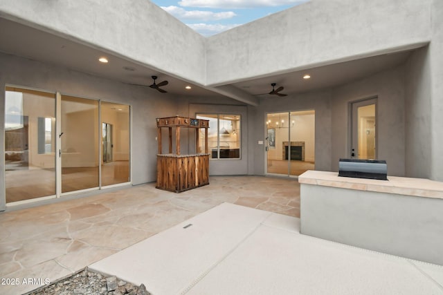 view of patio / terrace featuring a ceiling fan