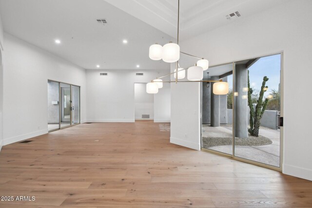 interior space featuring light wood-type flooring, visible vents, and recessed lighting