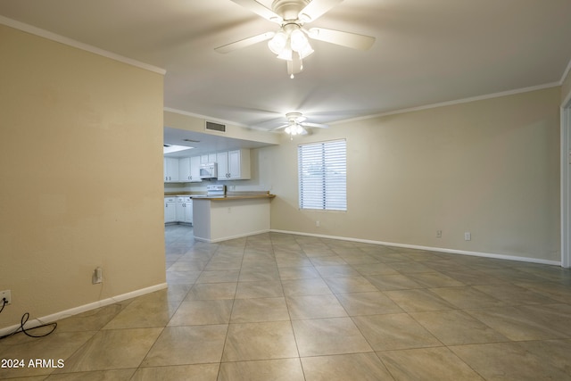 unfurnished living room featuring crown molding, light tile patterned flooring, and ceiling fan