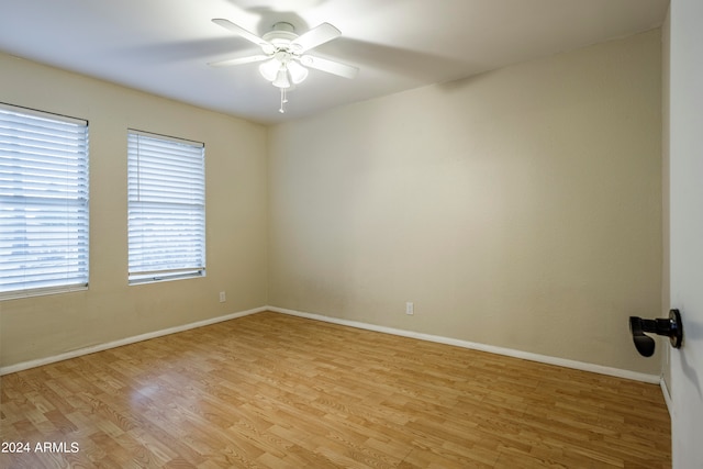 unfurnished room with light hardwood / wood-style flooring and ceiling fan