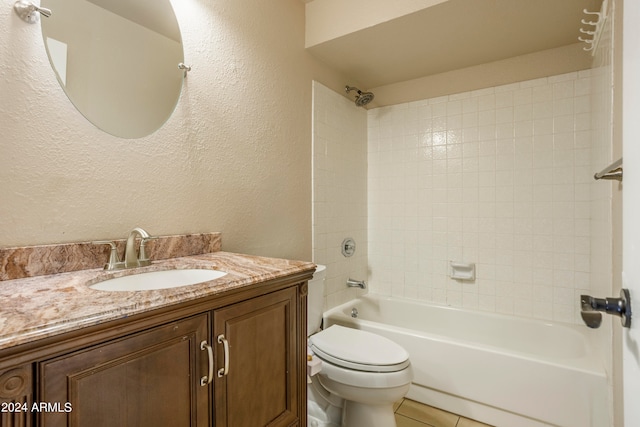 full bathroom featuring vanity, toilet, tile patterned floors, and tiled shower / bath