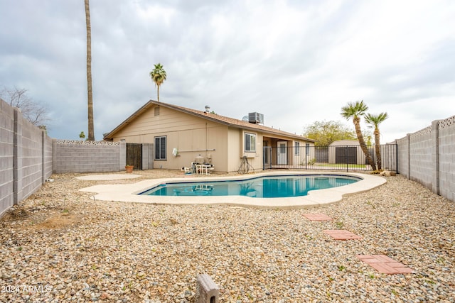 view of swimming pool with a patio and central AC