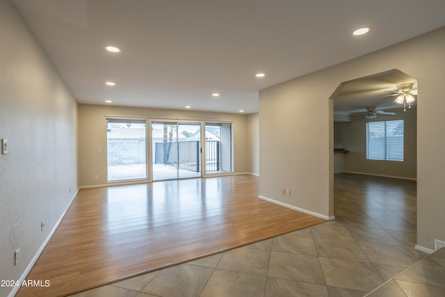 unfurnished room featuring light hardwood / wood-style flooring and ceiling fan