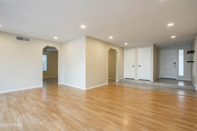 spare room with light wood-type flooring