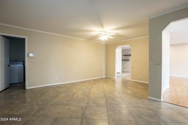 spare room featuring washer / dryer, ornamental molding, light hardwood / wood-style flooring, and ceiling fan