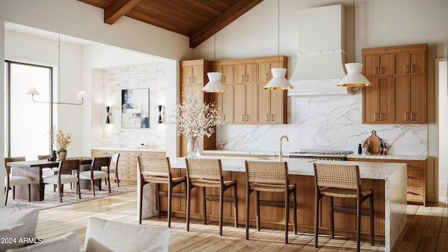 kitchen featuring light hardwood / wood-style floors, wood ceiling, and backsplash