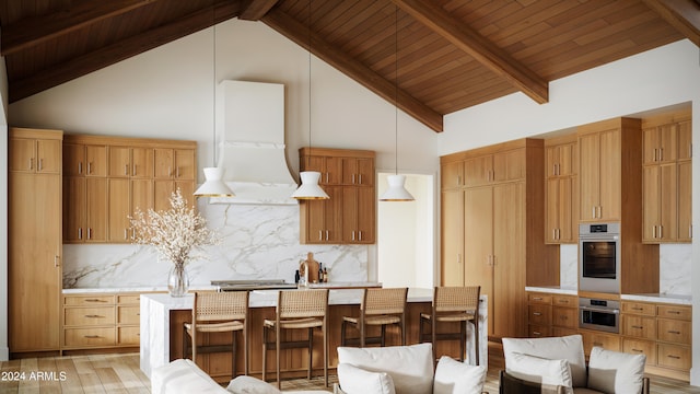 kitchen with light hardwood / wood-style floors, high vaulted ceiling, oven, and hanging light fixtures