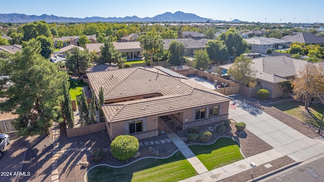 birds eye view of property featuring a mountain view