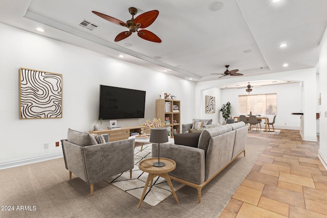 living room featuring a raised ceiling