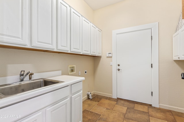 laundry room featuring hookup for an electric dryer, hookup for a washing machine, cabinets, and sink