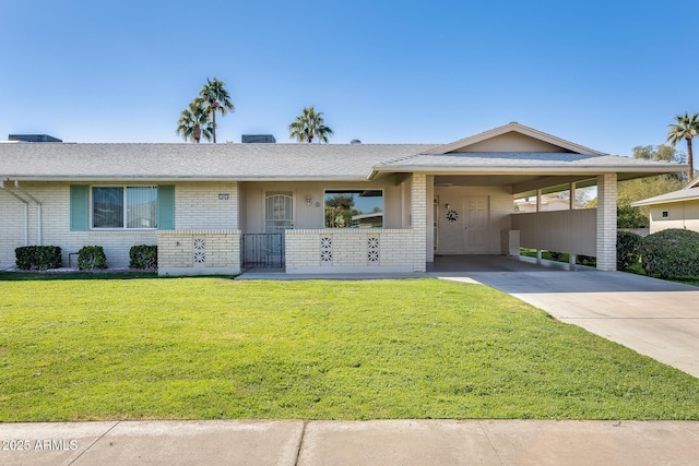 ranch-style home with a front yard and a carport