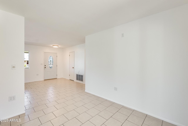 entrance foyer featuring light tile patterned flooring