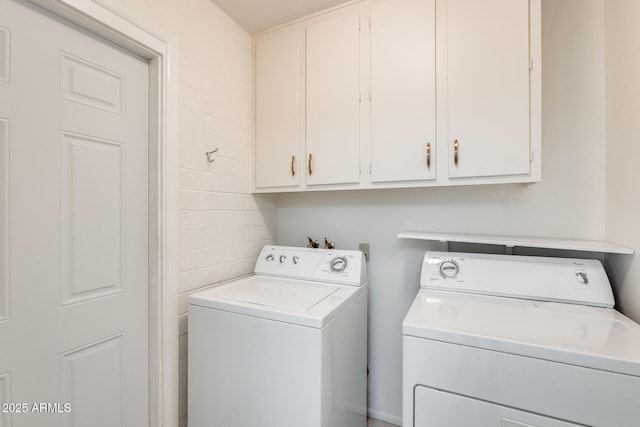 laundry area featuring cabinets and independent washer and dryer