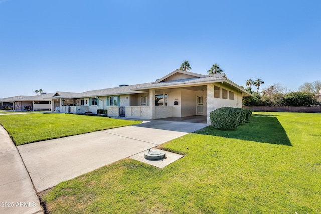 ranch-style home featuring a front yard and a carport