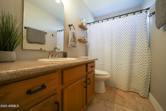 full bath featuring vanity, toilet, baseboards, and tile patterned floors