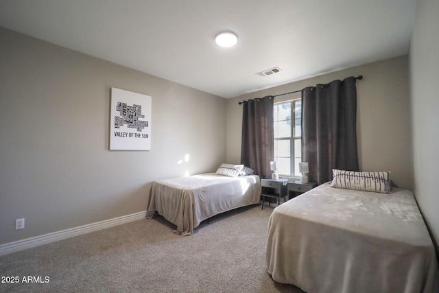 bedroom with baseboards, carpet flooring, and visible vents