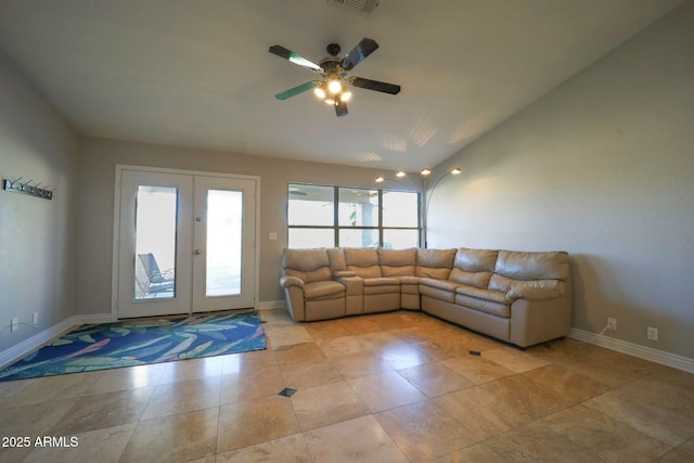 living area featuring baseboards, lofted ceiling, french doors, and ceiling fan