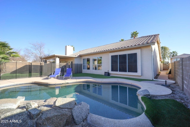 view of swimming pool featuring a patio area, a fenced in pool, and a fenced backyard