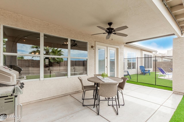 view of patio featuring french doors and ceiling fan
