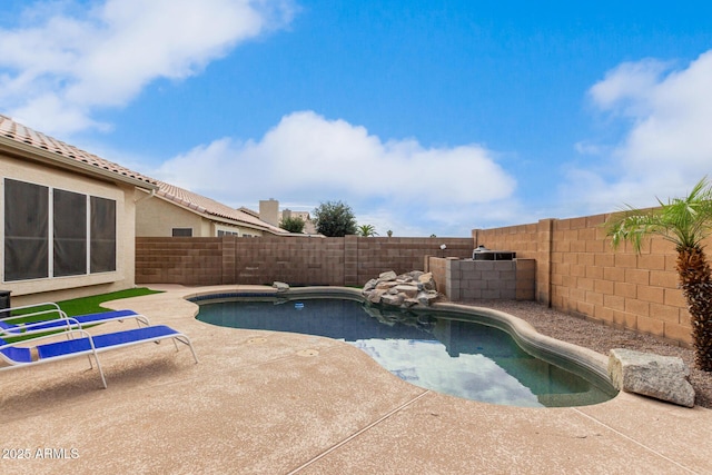 view of pool featuring a fenced backyard and a patio area