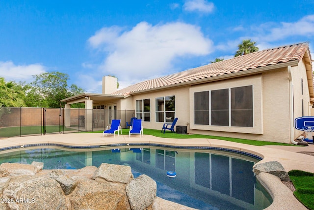 view of pool featuring fence and a patio area