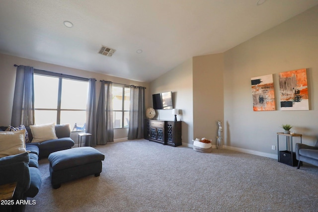 sitting room with carpet, visible vents, baseboards, and lofted ceiling