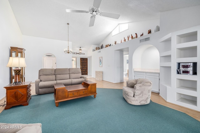 living room with a textured ceiling, built in features, light hardwood / wood-style floors, and vaulted ceiling