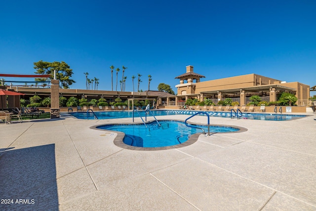 view of pool featuring a patio