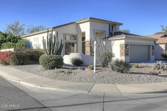 1635 W Windsong Dr, Phoenix, AZ 85045 - view of front of house featuring stucco siding, a garage, stone siding, and a tile roof