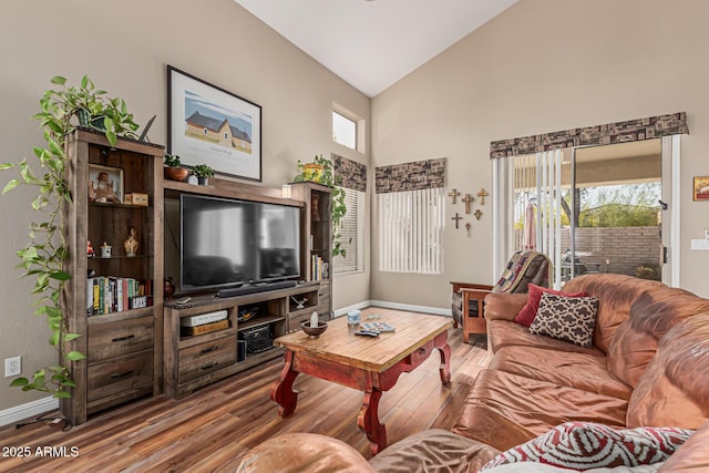 1635 W Windsong Dr, Phoenix, AZ 85045 - living area with high vaulted ceiling, baseboards, and wood finished floors