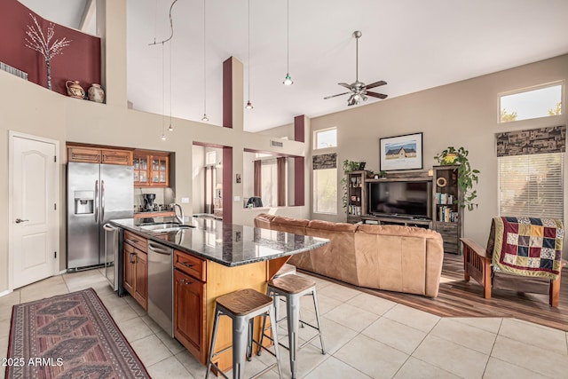 1635 W Windsong Dr, Phoenix, AZ 85045 - kitchen featuring light tile patterned floors, a sink, appliances with stainless steel finishes, and ceiling fan