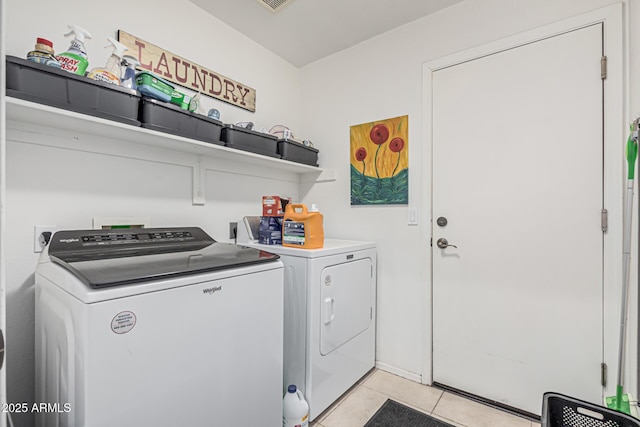 1635 W Windsong Dr, Phoenix, AZ 85045 - washroom featuring washing machine and clothes dryer, light tile patterned floors, laundry area, and visible vents