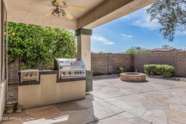 1635 W Windsong Dr, Phoenix, AZ 85045 - view of patio / terrace with a grill, a fire pit, a fenced backyard, and a ceiling fan