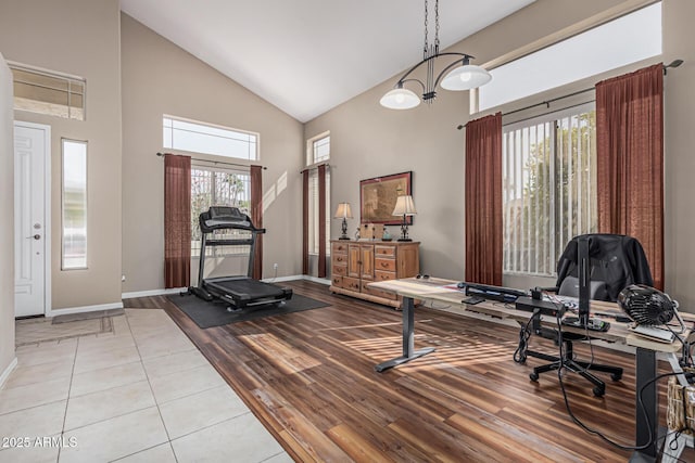 1635 W Windsong Dr, Phoenix, AZ 85045 - workout area featuring baseboards, high vaulted ceiling, and wood finished floors