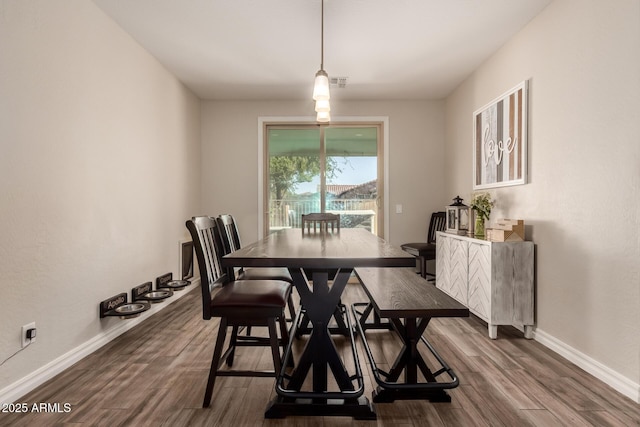 1217 W Fever Tree Ave, San Tan Valley, AZ 85140 - dining area featuring dark wood-style floors and baseboards