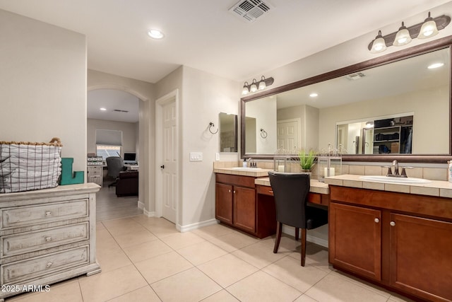 1217 W Fever Tree Ave, San Tan Valley, AZ 85140 - bathroom featuring double vanity, tile patterned flooring, baseboards, and recessed lighting