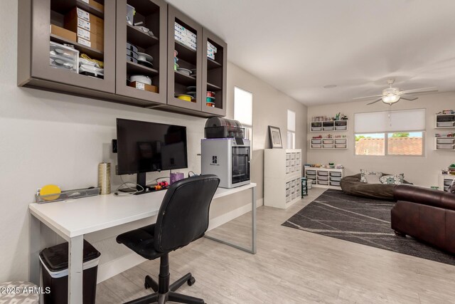 1217 W Fever Tree Ave, San Tan Valley, AZ 85140 - office area featuring light wood-type flooring, ceiling fan, and baseboards