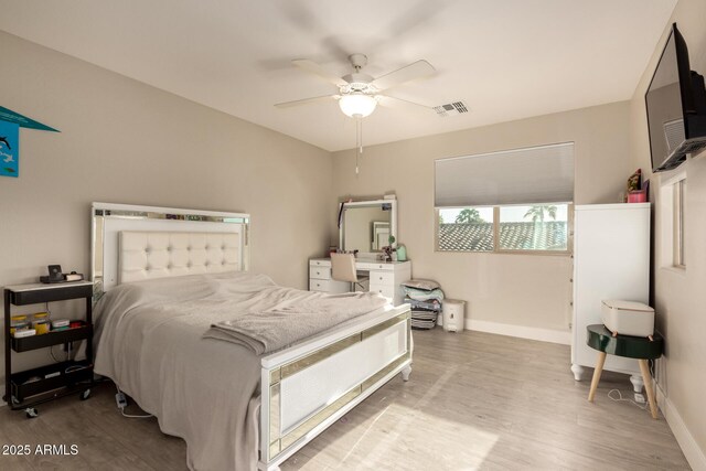 1217 W Fever Tree Ave, San Tan Valley, AZ 85140 - bedroom featuring wood finished floors, baseboards, and a ceiling fan