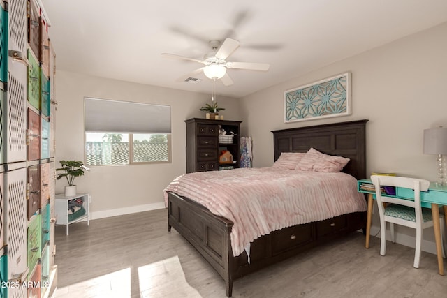 1217 W Fever Tree Ave, San Tan Valley, AZ 85140 - bedroom featuring light wood-type flooring, baseboards, and a ceiling fan