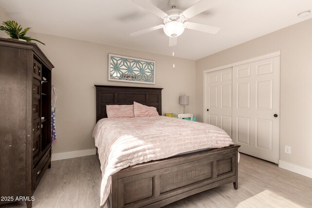 1217 W Fever Tree Ave, San Tan Valley, AZ 85140 - bedroom with light wood-style flooring, a closet, baseboards, and ceiling fan