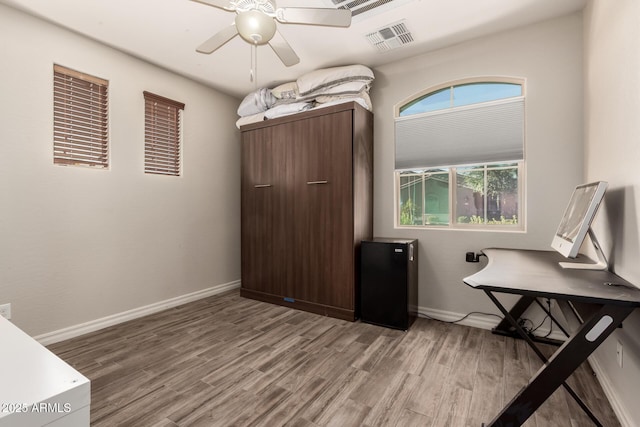 1217 W Fever Tree Ave, San Tan Valley, AZ 85140 - office area featuring light wood finished floors, a ceiling fan, and baseboards