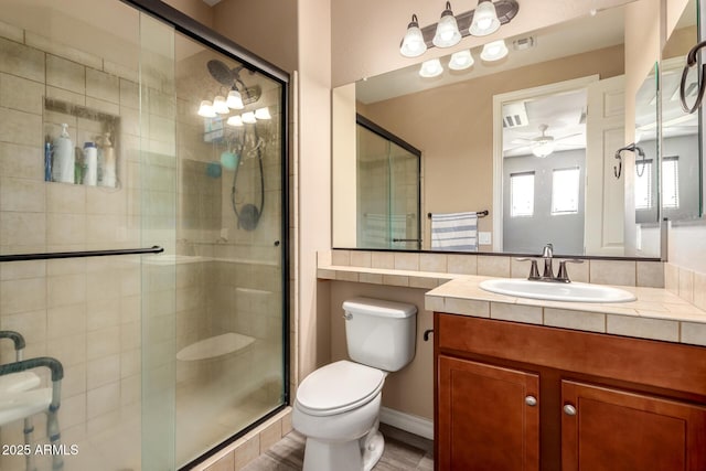 1217 W Fever Tree Ave, San Tan Valley, AZ 85140 - full bath with toilet, a shower stall, a ceiling fan, and vanity