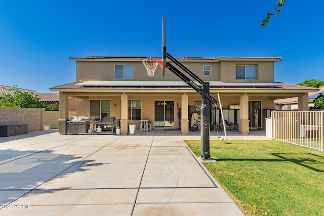 1217 W Fever Tree Ave, San Tan Valley, AZ 85140 - rear view of house with stucco siding, a patio, and solar panels