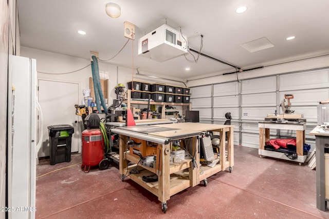 1217 W Fever Tree Ave, San Tan Valley, AZ 85140 - garage with freestanding refrigerator, recessed lighting, a heating unit, and a workshop area