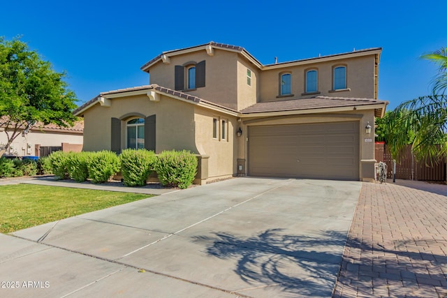 1217 W Fever Tree Ave, San Tan Valley, AZ 85140 - mediterranean / spanish-style home featuring stucco siding, an attached garage, driveway, a tile roof, and fence