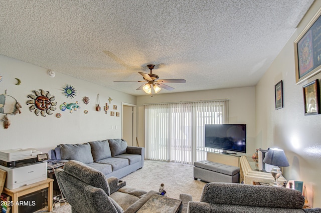 living room featuring a textured ceiling, carpet floors, and ceiling fan