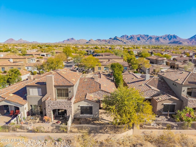 birds eye view of property with a mountain view