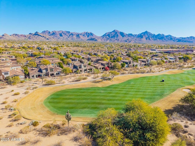 birds eye view of property with a mountain view